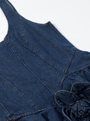 Denim mini dress with floral applique detail and ruffled hem.