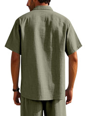 Classic short sleeve button-down shirt in military green, collared with a breathable fabric.
