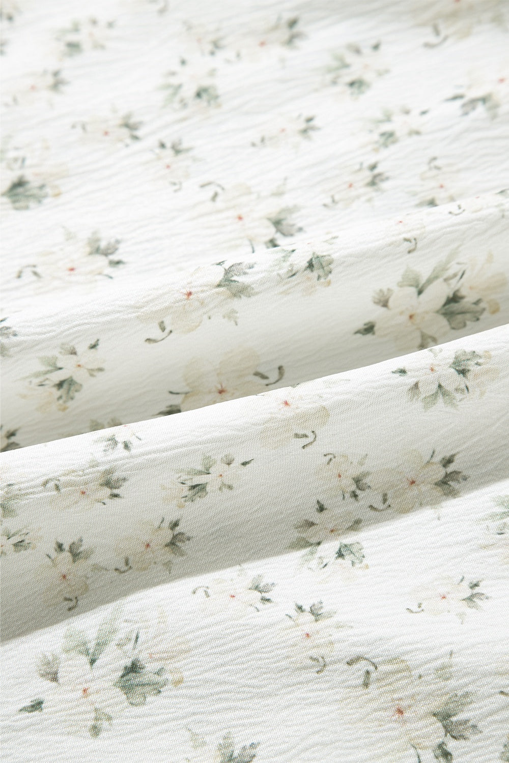 White floral smocked bodice wide-leg jumpsuit fabric detail