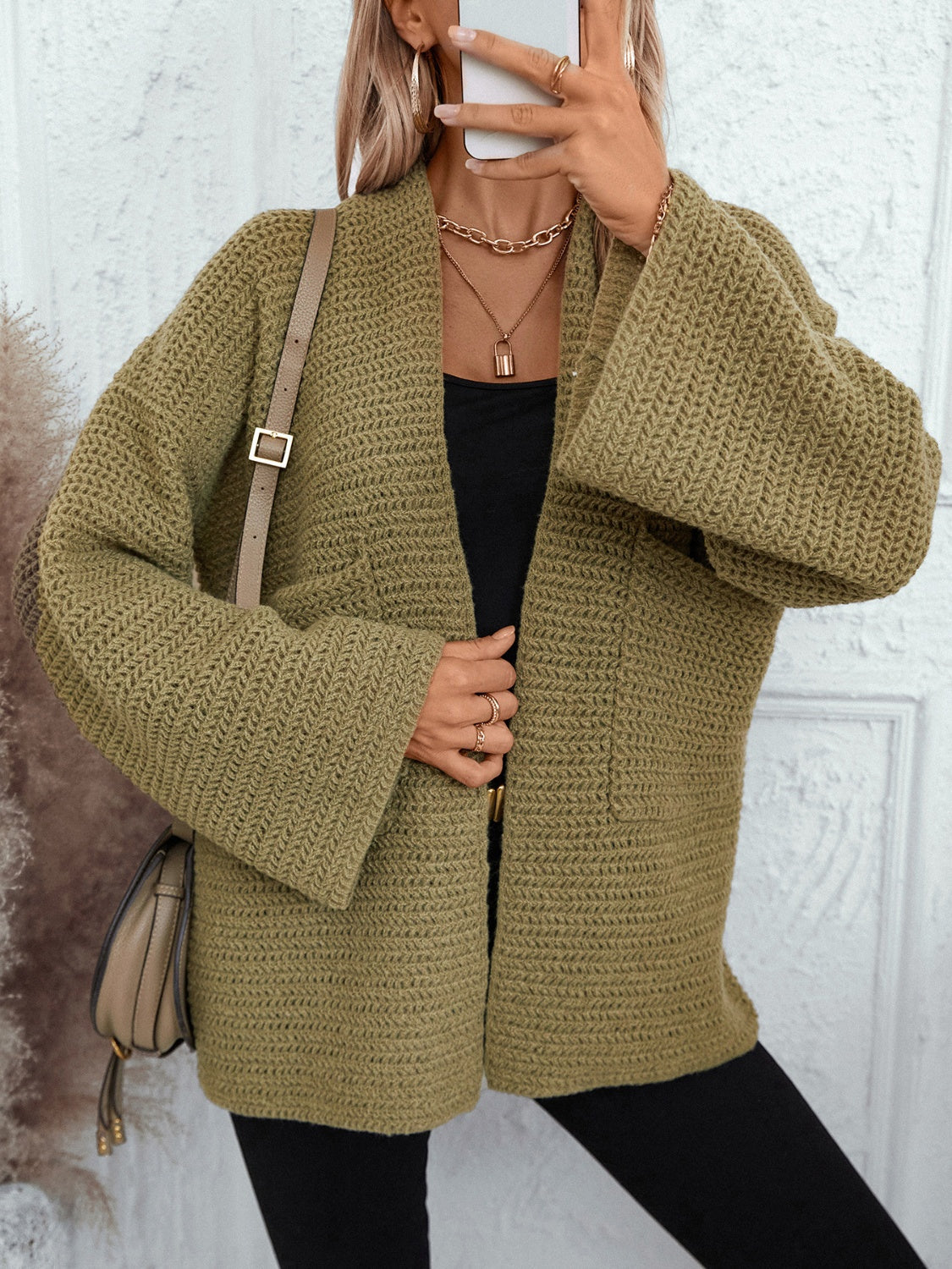 Chunky knit open front cardigan in moss with wide sleeves and pockets.