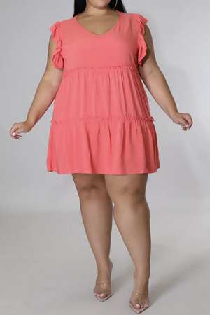 Coral tiered ruffle babydoll mini dress with V-neck and flutter sleeves.