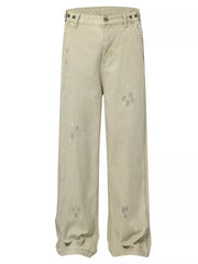 Loose fit sweatpants in beige with ink-splash detail and a comfortable casual style.