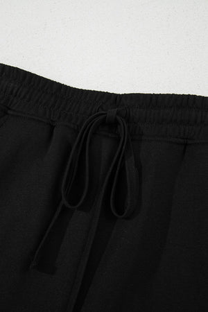 Black French terry skort with drawstring waist and pockets