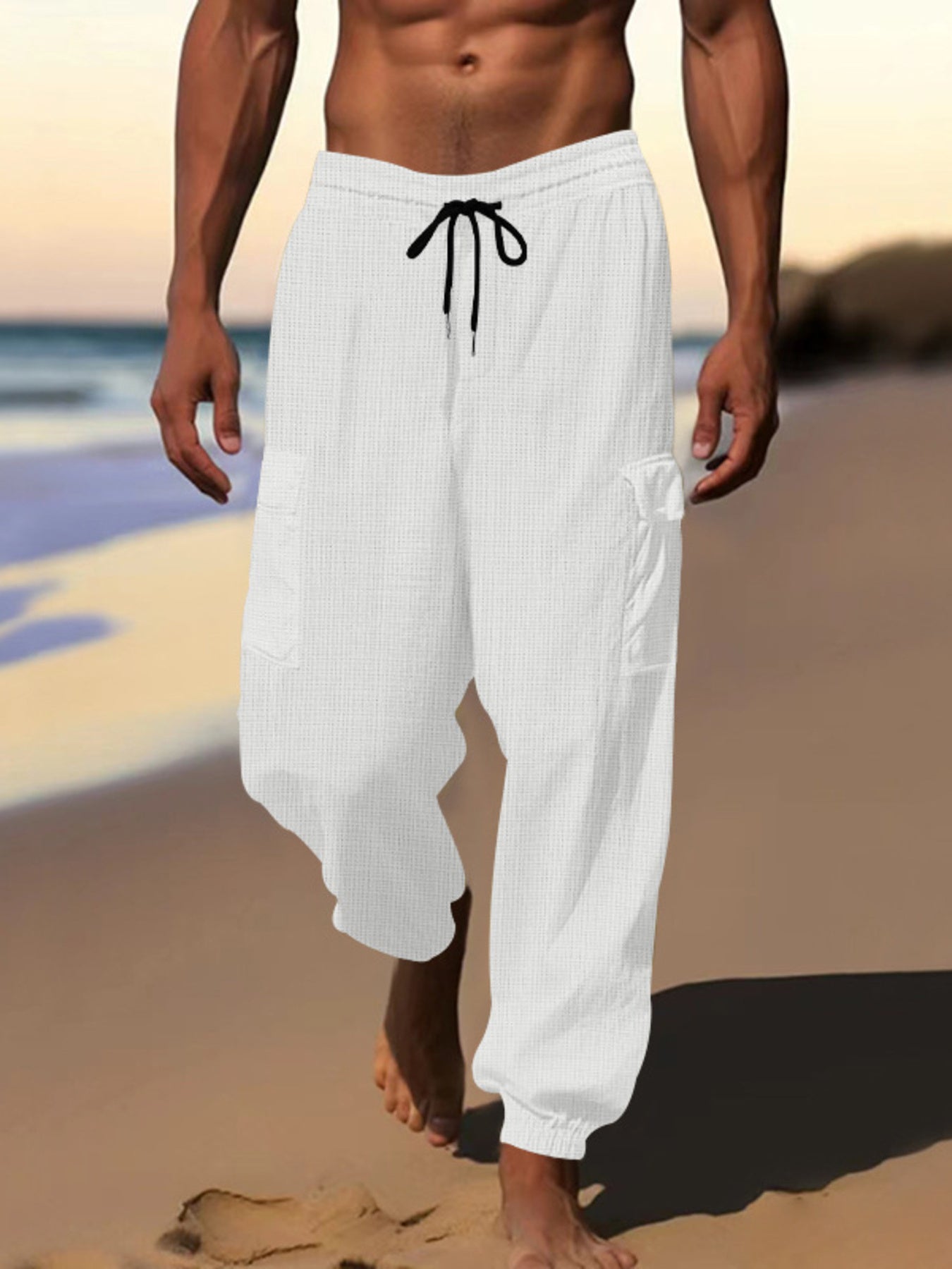 White waffle knit joggers with drawstring and cargo pockets.