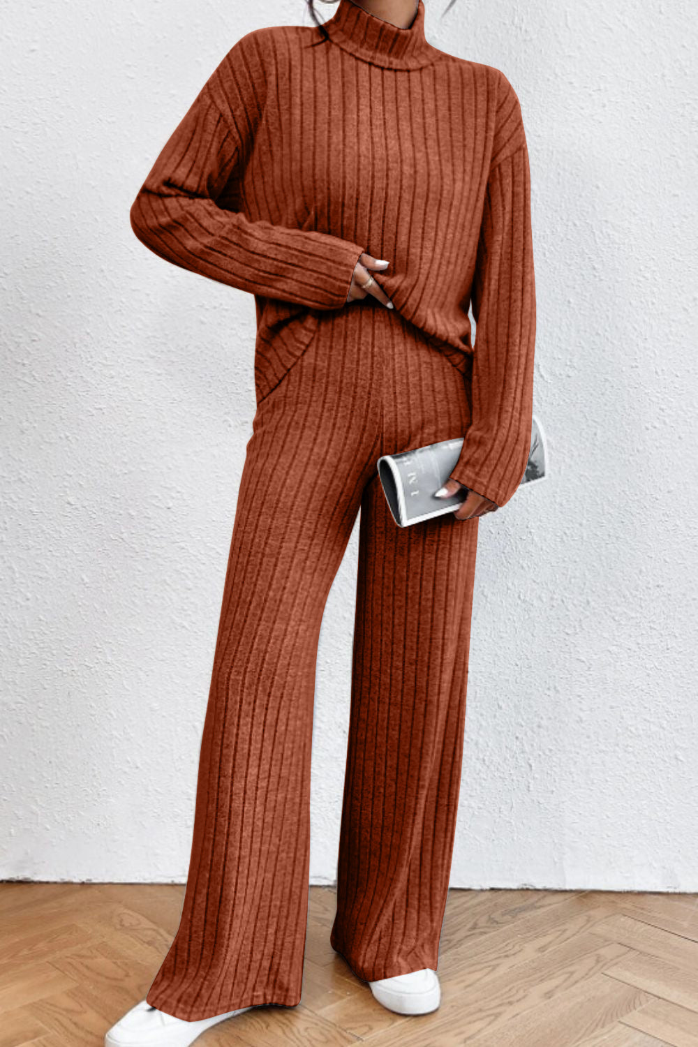 Ribbed knit turtleneck lounge set in rust with wide leg pants and long sleeves.