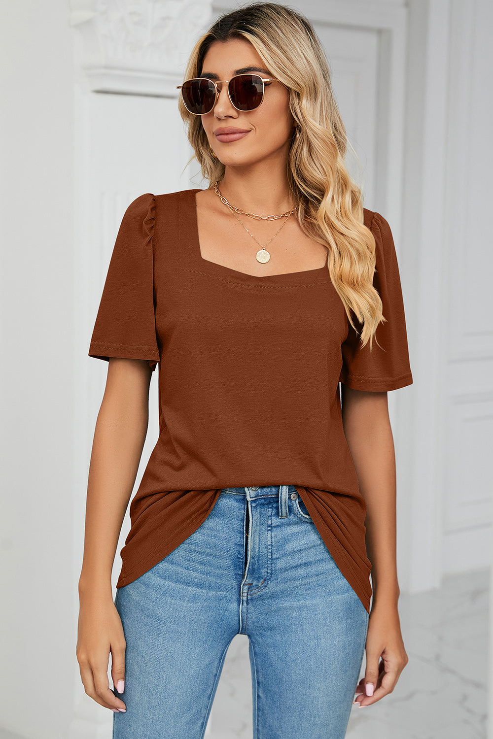 Caramel tee with square neckline and sculpted puff sleeves.