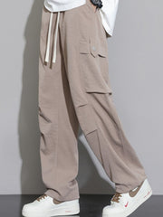 Men's relaxed fit cargo sweatpants in Dust Storm with drawstring waist and multiple pockets.