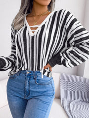 Black and white striped knit cropped pullover sweater with lace-up neckline.