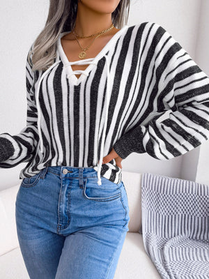 Black and white striped knit cropped pullover sweater with lace-up neckline.