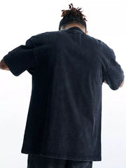 Black oversized cotton graphic tee with crew neck and short sleeves, vintage wash