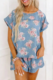 Floral denim two-piece set with short sleeves and shorts.