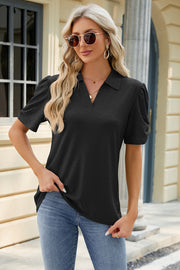 Black perforated polo top with short puff sleeves and a v-neck.
