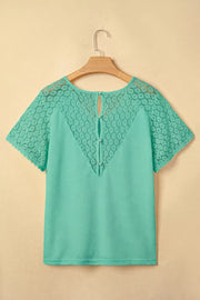 Teal waffle knit shirt with lace detail on sleeves and back, V-neck, short sleeves, button back detail.