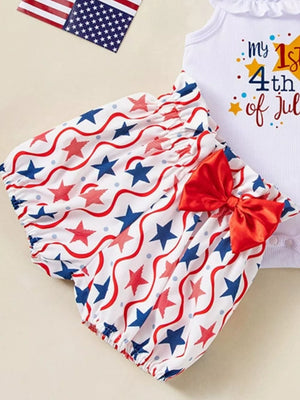 Baby patriotic bloomer shorts with stars and waves pattern, red bow detail.