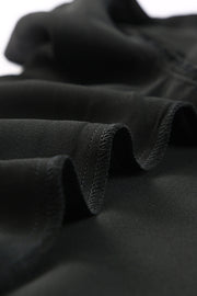 Black tie-front blouse with ruffled sleeves and a button-down front.