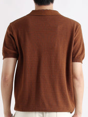 Brown short-sleeve knit polo shirt with textured fabric and button detail.