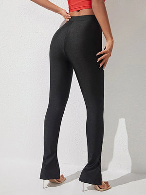Black cotton leggings with center seam and split hem detail