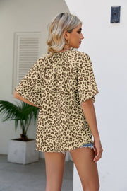 Tan leopard print v-neck blouse with short sleeves.