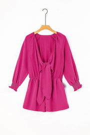 Cerise tie-front blouson sleeve playsuit with smocked cuffs and elastic waist.