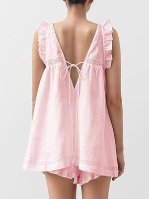 Blush pink ruffled V-neck top and shorts set with lace trim and tie back.