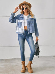 Denim trucker jacket with python pattern panels and chest pockets.