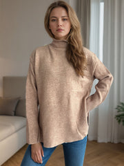 Camel ribbed hemline slit-side turtleneck knit sweater with ribbed cuffs.