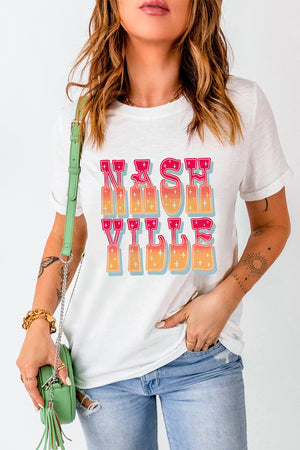 White t-shirt with "Nashville Vibe" in retro gradient typography and sparkle details.