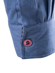 Men's dark blue cotton denim shirt cuff detail with red button and patterned trim
