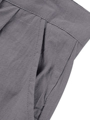 Grey sweatpants with pleats and a pocket detail.