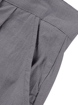 Grey sweatpants with pleats and a pocket detail.