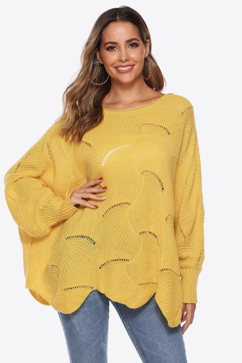 Yellow openwork knit sweater with boat neck and cocoon sleeves.