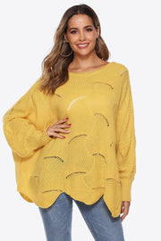 Yellow openwork knit sweater with boat neck and cocoon sleeves.