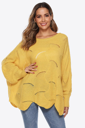 Yellow openwork knit sweater with boat neck and cocoon sleeves.