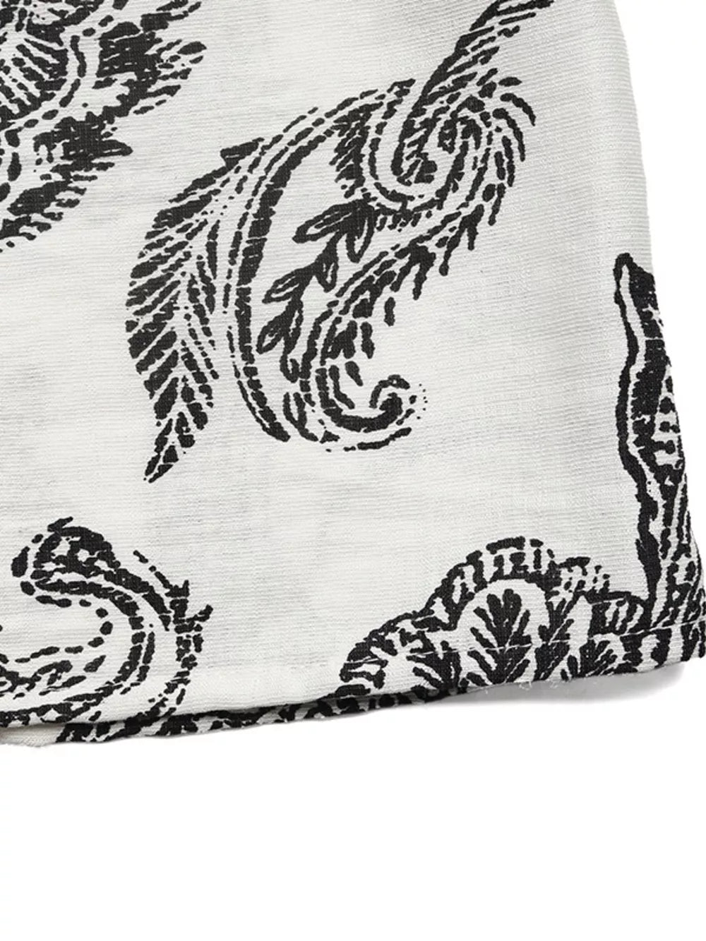 Paisley print maternity maxi dress in black and white with ruffled hem detail.