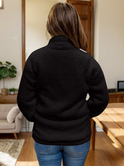 Black textured sherpa zip-up jacket with stand collar, shown from the back.
