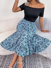 Floral print off-shoulder midi dress in sky blue with black floral pattern and ruffled hem.