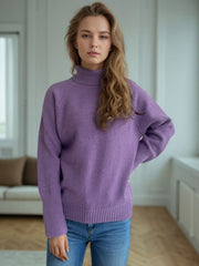Purple ribbed turtleneck sweater with subtle sparkle detail and cuffed sleeves.