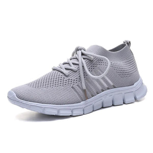 Gray knit runner sneaker with ribbed detail and white sole.