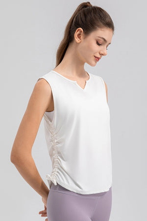 White active tank top with notched neckline and side ruching detail.