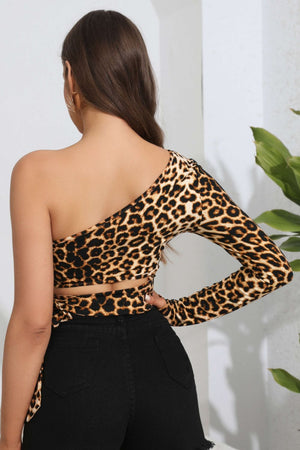 Leopard print cutout wrap top with one long sleeve and a tie waist detail.