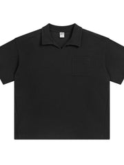 Black boxy knit polo shirt with short sleeves and a patch pocket.