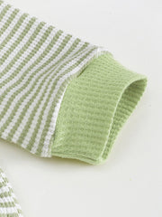 Children's green and white striped polo shirt sleeve with waffle knit cuff