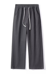 Relaxed fit dark gray cotton drawstring pants with side pockets.