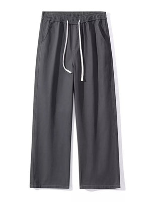 Relaxed fit dark gray cotton drawstring pants with side pockets.