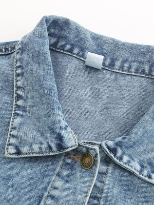 Light wash oversized denim jacket with button closure and collar detail.