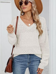 White eyelet stitch V-neck pullover sweater with long sleeves and a relaxed fit.
