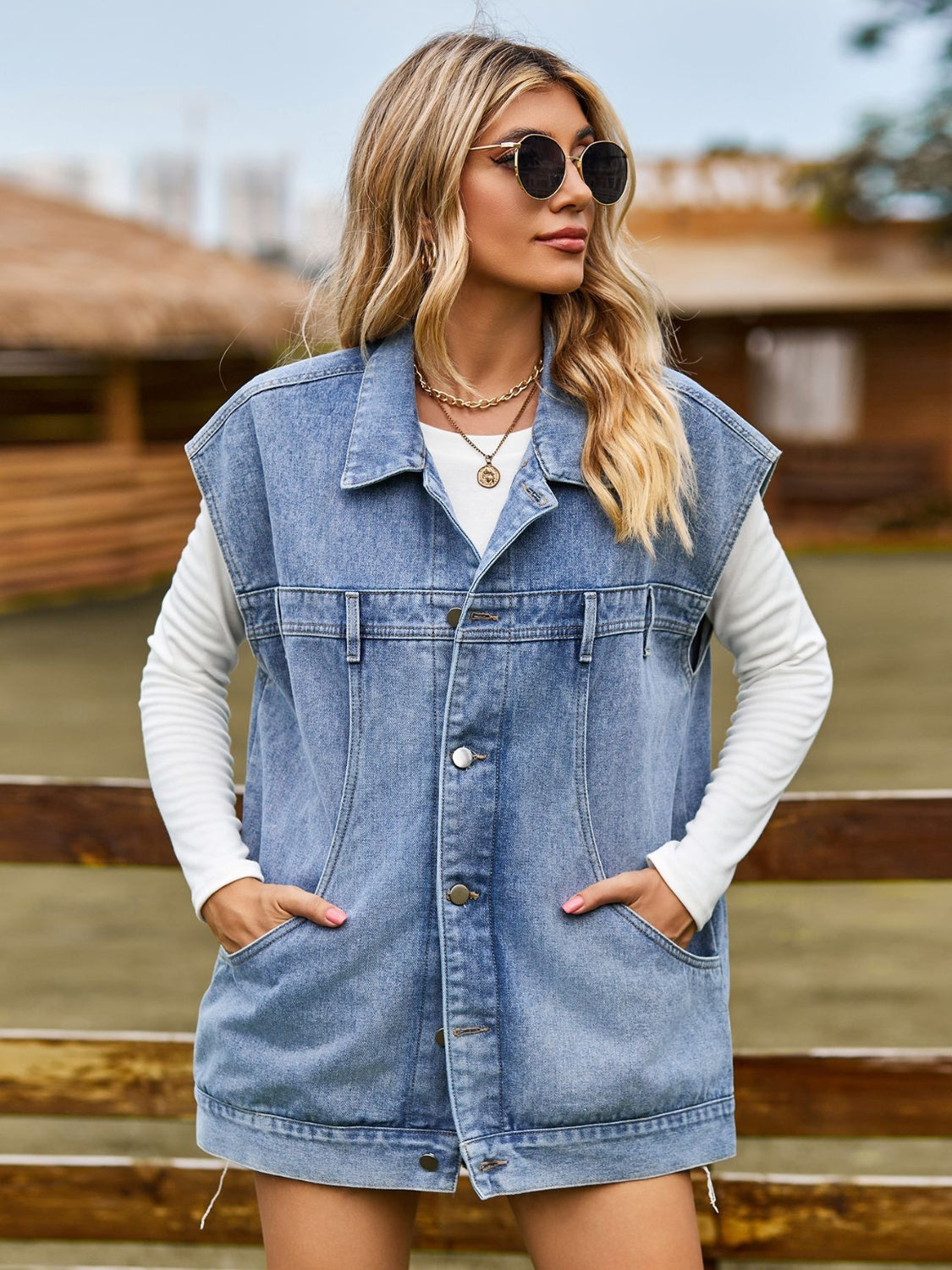 Oversized denim sleeveless jacket in dusty blue with button front and pockets