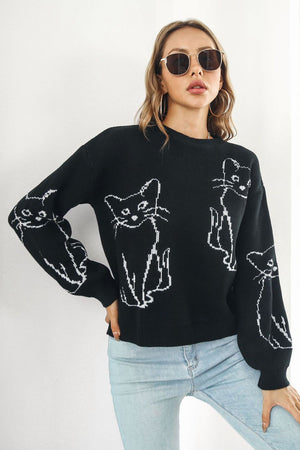 Black acrylic sweater with white cat intarsia knit pattern, crew neck, and long sleeves.