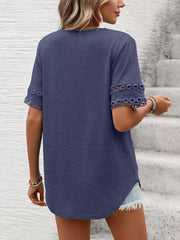 Navy blue t-shirt with lace trim on the sleeves and a V-neck.