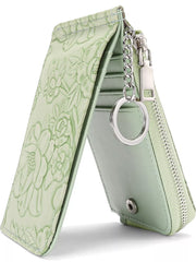 Sage floral embossed mini wallet with zipper and keychain detail.